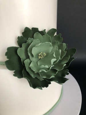 Green and white fondant wedding cake with sugar flowers